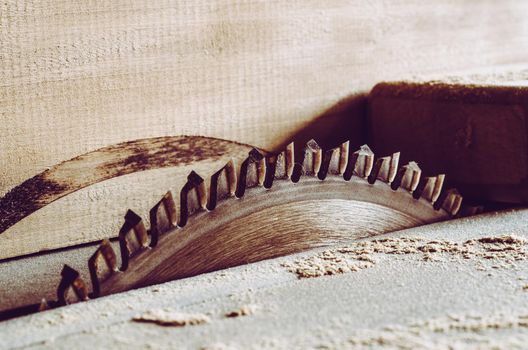 Saws details of furniture with a circular saw. close up. circular saw for cutting wood.