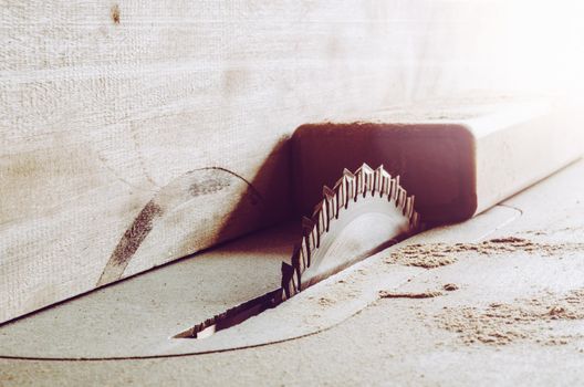 Saws details of furniture with a circular saw. close up. circular saw for cutting wood.