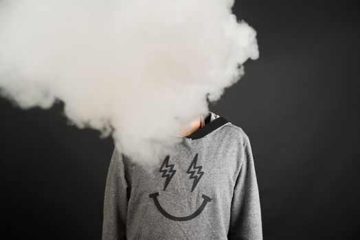 Concept. Smoke enveloped the head man. Secondhand smoke