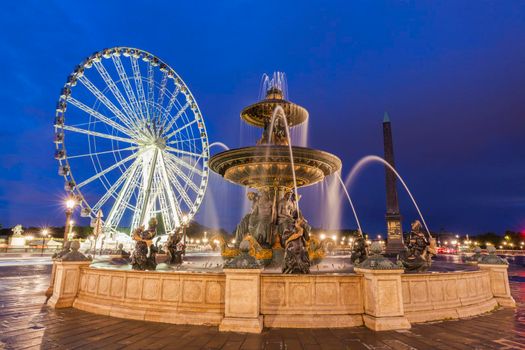 Fontaine des Fleuves and Ferris Wheel on Place de la Concorde in Paris. Paris, France.