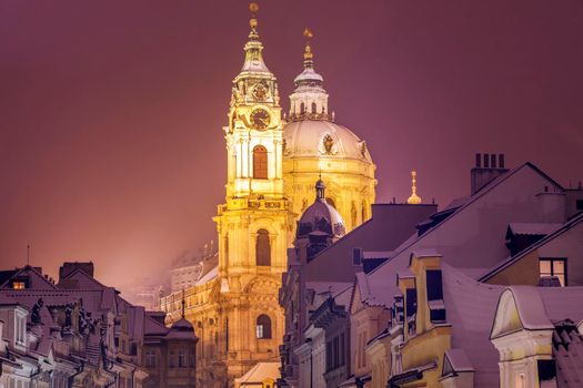 Winter in Prague - city panorama with St. Nicholas Church. Prague, Bohemia, Czech Republic.