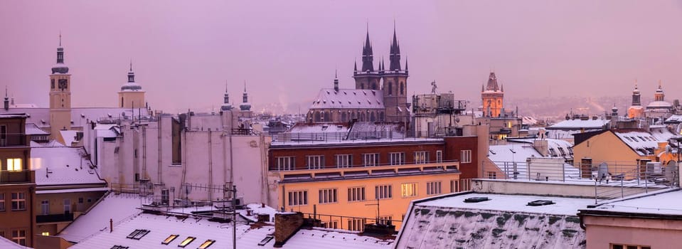 Winter in Prague - city panorama with Tyn Cathedral and Clock Tower. Prague, Bohemia, Czech Republic.