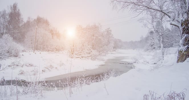 Winter snow landscape with a river . Russian winter. Winter. Landscape with a river. Sun and snow. The gentle landscape. Photos for printed products. Article about winter travel.