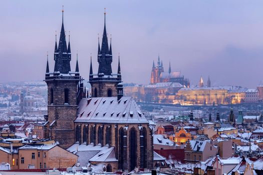 Winter in Prague - city panorama with Tyn Cathedral and St. Vitus Cathedral. Prague, Bohemia, Czech Republic.