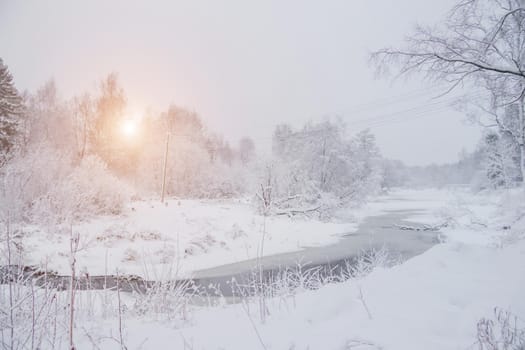 Winter snow landscape with a river . Russian winter. Winter. Landscape with a river. Sun and snow. The gentle landscape. Photos for printed products. Article about winter travel.
