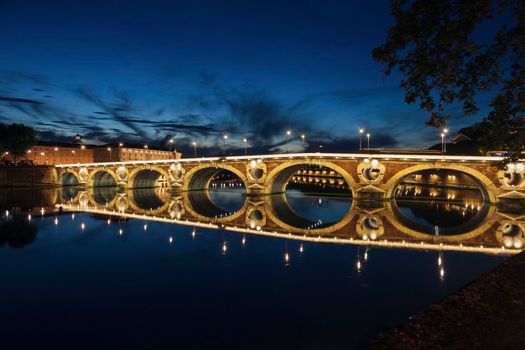 Pont Neuf in Toulouse seen at night. Toulouse, Occitanie, France.