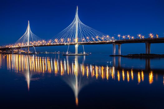 Cable-stayed bridge ZSD at night. Modern high bridge over the river. Night landscape of the city of Saint Petersburg. Sights Of Saint Petersburg. Night city. Road bridge . Saint Petersburg, Russia