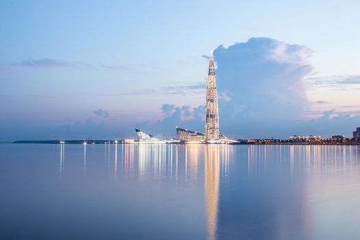 Lakhta center in Saint Petersburg at night. Modern high building. White night. Long-exposure photos. Calm and serene. Article about modern buildings. Cover for printed products. Russia, Saint Petersburg June 19, 2020