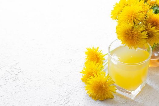 Dandelion tea. Yellow summer flowers dandelions. Tea party Homemade drink. Certified flower tea. Yellow drink. An article about teas. Hot drinks article