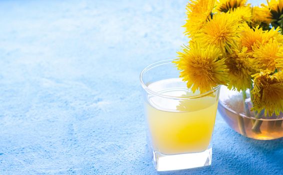 Dandelion tea. Yellow summer flowers dandelions. Tea party Homemade drink. Certified flower tea. Yellow drink. An article about teas. Hot drinks article