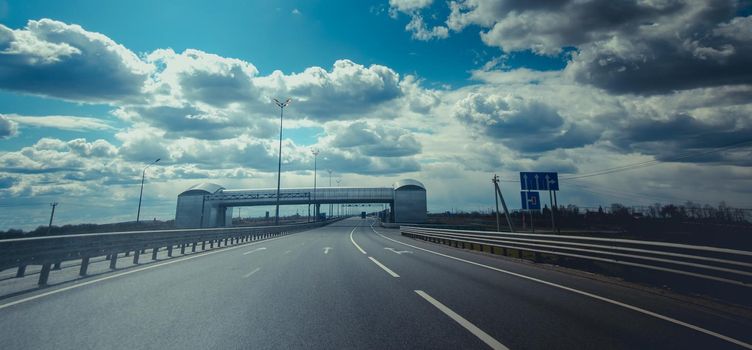 Russian highways. Pedestrian bridge over the highway. Route and movement of cars. Traveling around the country. Autotrip.