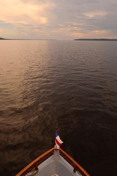 Rio Negro waters and the jungle at sunset, Amazon, Brazil.