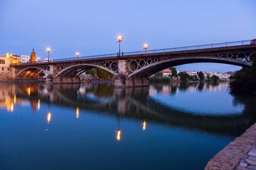 Chapel of Carmen and Isabel II Bridge in Seville. Seville, Andalusia, Spain.