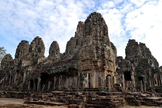 The faces of the Bayon in a cloudy day, Angkor Thom, Cambodia.