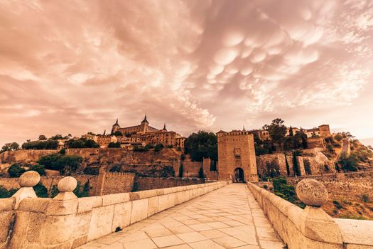 Mammatus clouds over Alcantara Bridge in Toledo. Toledo, Castile–La Mancha, Spain.