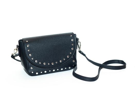Women's black bag isolated on a white background . Leatherette bag. Article about fashion and trends. Accessories for women. Ladies ' bag. Small bag. Modern fashion