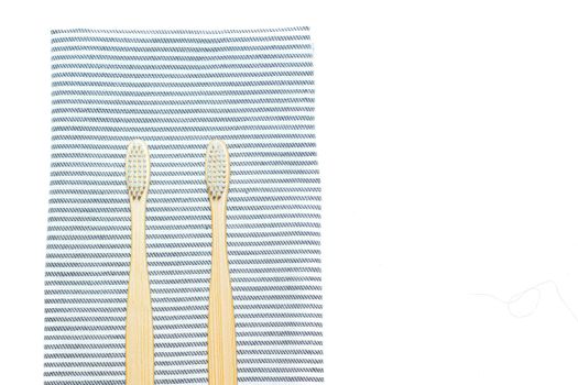 Bamboo toothbrush on a towel. Tooth cleaning. Article about choosing a toothbrush. Article about dental care. Bath accessories. Collection on vacation. Striped towel. Natural material. Eco-products. No plastic surgery. Concern for the environment. Copy space.