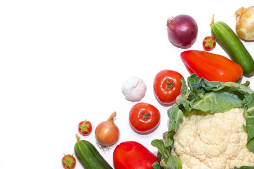 Vegetables layout on a white background . Home-grown vegetables. Harvest. Window dressing. Isolated vegetables. Article about vegetables. Agricultural industry. Copy space