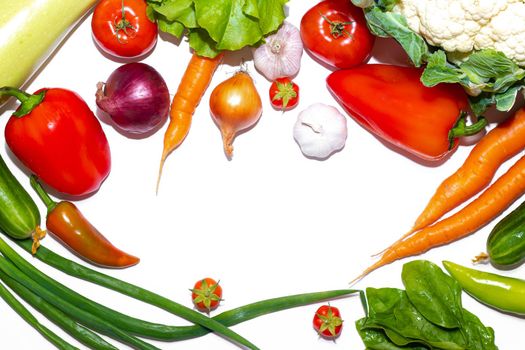 Vegetables layout on a white background . Home-grown vegetables. Harvest. Window dressing. Isolated vegetables. Article about vegetables. Agricultural industry. Copy space