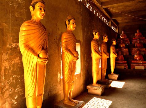 View of the statues inside the giant Buddha in the Wat Ek Phnom complex, Battambang, Cambodia