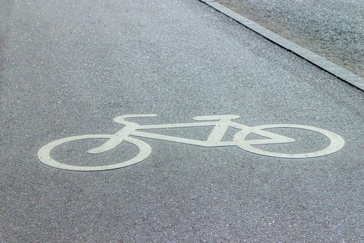 City bike path . Paved roads for bicyclists in the city. Bike lane sign. The article is about cyclists. Opening of the bike path. Europe. Copy space