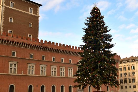 View of the famous Christmas tree in Piazza Venezia with few tourists due to the Covid19 epidemic.