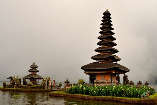 Incredible view of Pura Ulun Danu Bratan temple in a foggy day, Bali