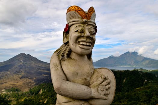 A statue in front of an amazing view of the mountains, Bali