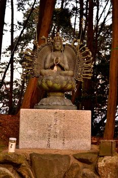 Closeup of a statue in the forest on the mt. Shosha, Himeji