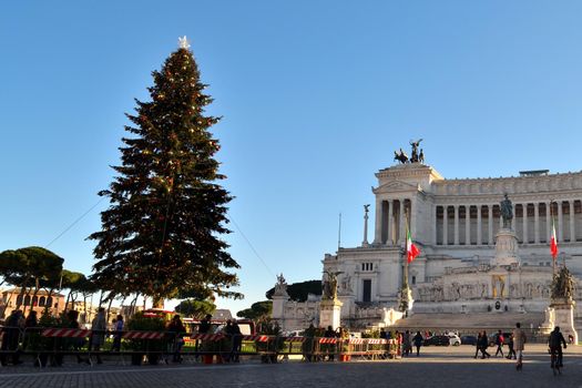 Rome, Italy - December 13th 2020: View of the famous Christmas tree in Piazza Venezia with few tourists due to the Covid19 epidemic.