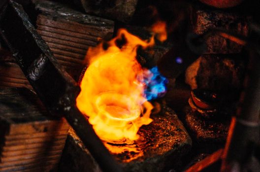 A melted silver in a jewelry workshop, melting silver.