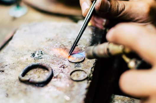 Industrial manufacture of the gold ring. Manufacture of a gold product in the jewelery workshop.