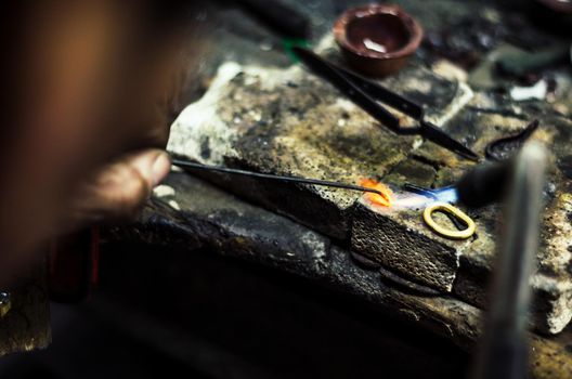 Industrial manufacture of the gold ring. Manufacture of a gold product in the jewelery workshop.