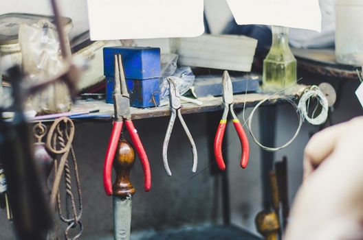 Different goldsmiths tools on the jewellery workshop.