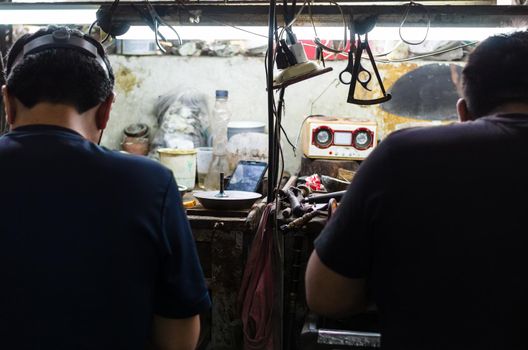 Jewelers at work, craftsmanship in a jewelry workshop, Jewelers in full action