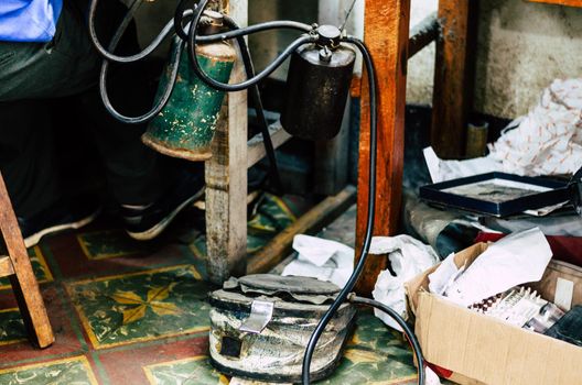 Fuel and treadle of the blowtorch of the jewellery workshop.