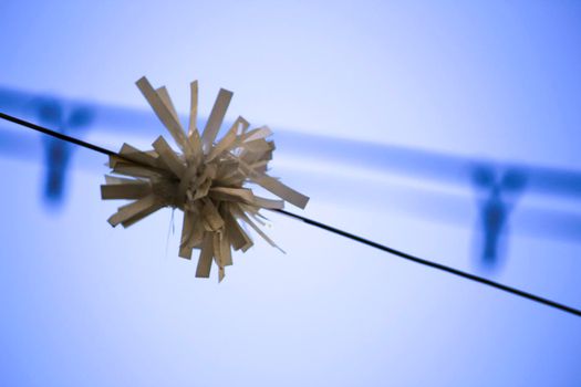 White garland hanging on the street in Lisbon, Portugal
