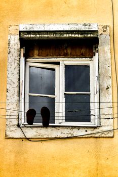 Old colorful and beautiful facades with vintage streetlight in Lisbon streets in Spring.