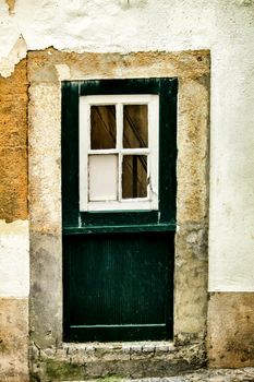Old and colorful green wooden in Lisbon, Portugal