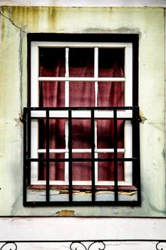 Old colorful typical facade in Lisbon with vintage wooden window