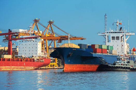 Container ship in export and import business and logistics. Shipping cargo to harbor by crane. Water transport International.