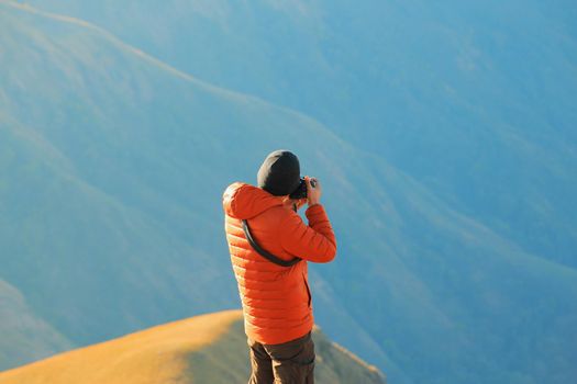 The cameraman was waiting to capture the sunrise in the morning.