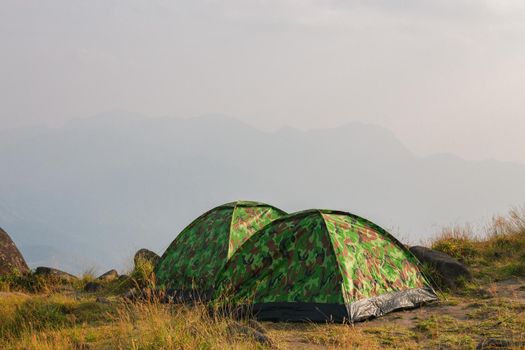 Set up a tent on the hill Full of grasslands