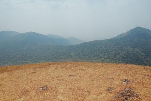 The highest point has mountains and the sky as the background.