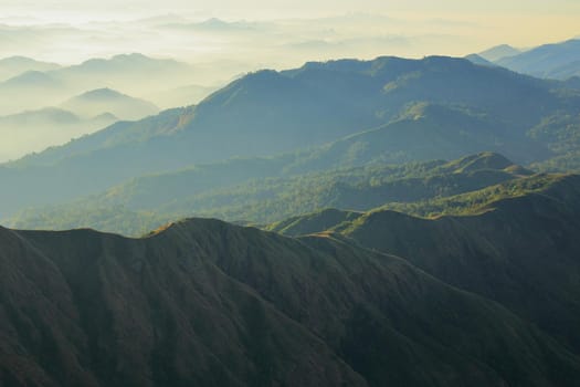 The green mountains in the morning are sunny.