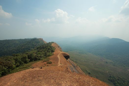 The highest point has mountains and the sky as the background.