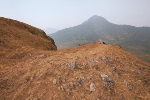 The highest point has mountains and the sky as the background.