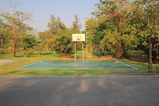 Basketball court That has only one basketball hoop in the park