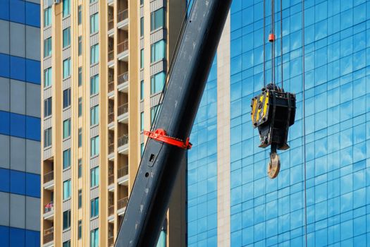 Construction crane With a background of tall buildings