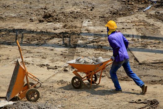 Construction worker And working in the construction area of ​​tall buildings